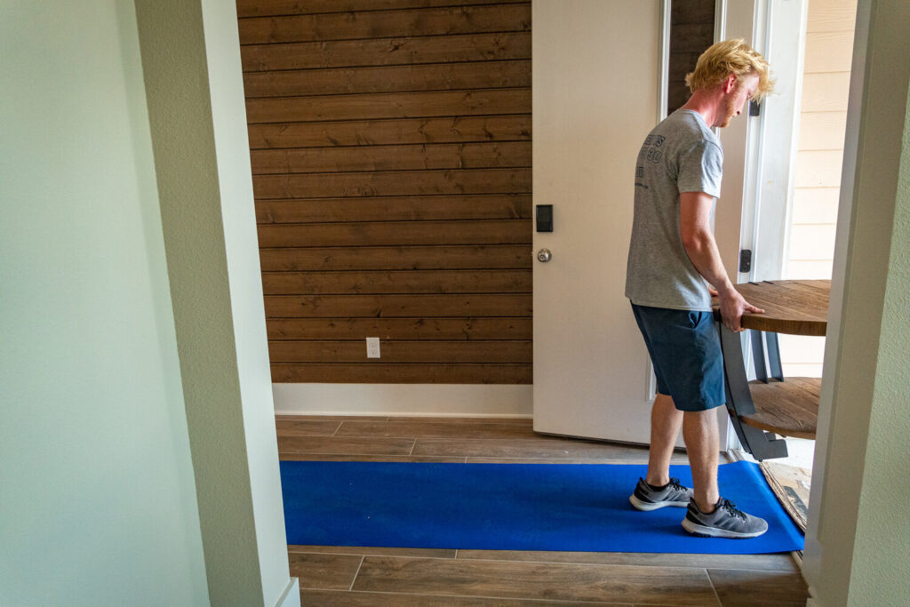 We lay down our blue carpet floor covering at the entryway of a home. It just keeps things cleaner.